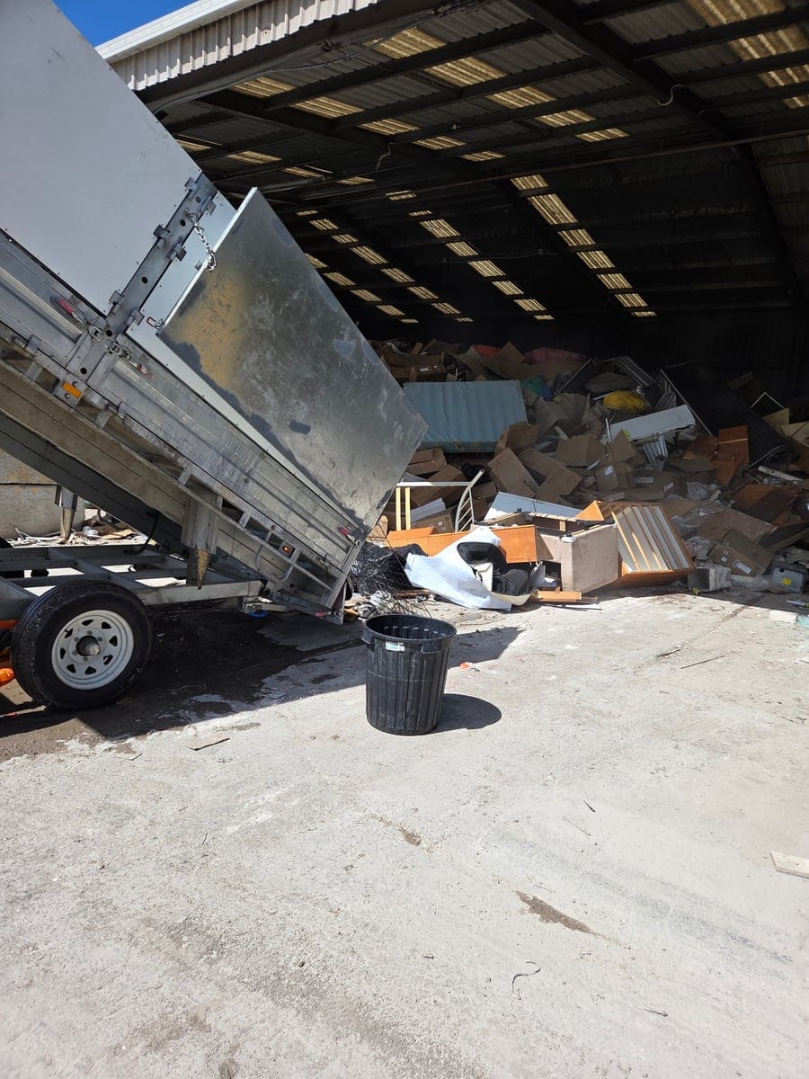 CleanUp Partners tip truck unloading bagged estate waste and demolished fixtures at a licensed Sydney transfer station